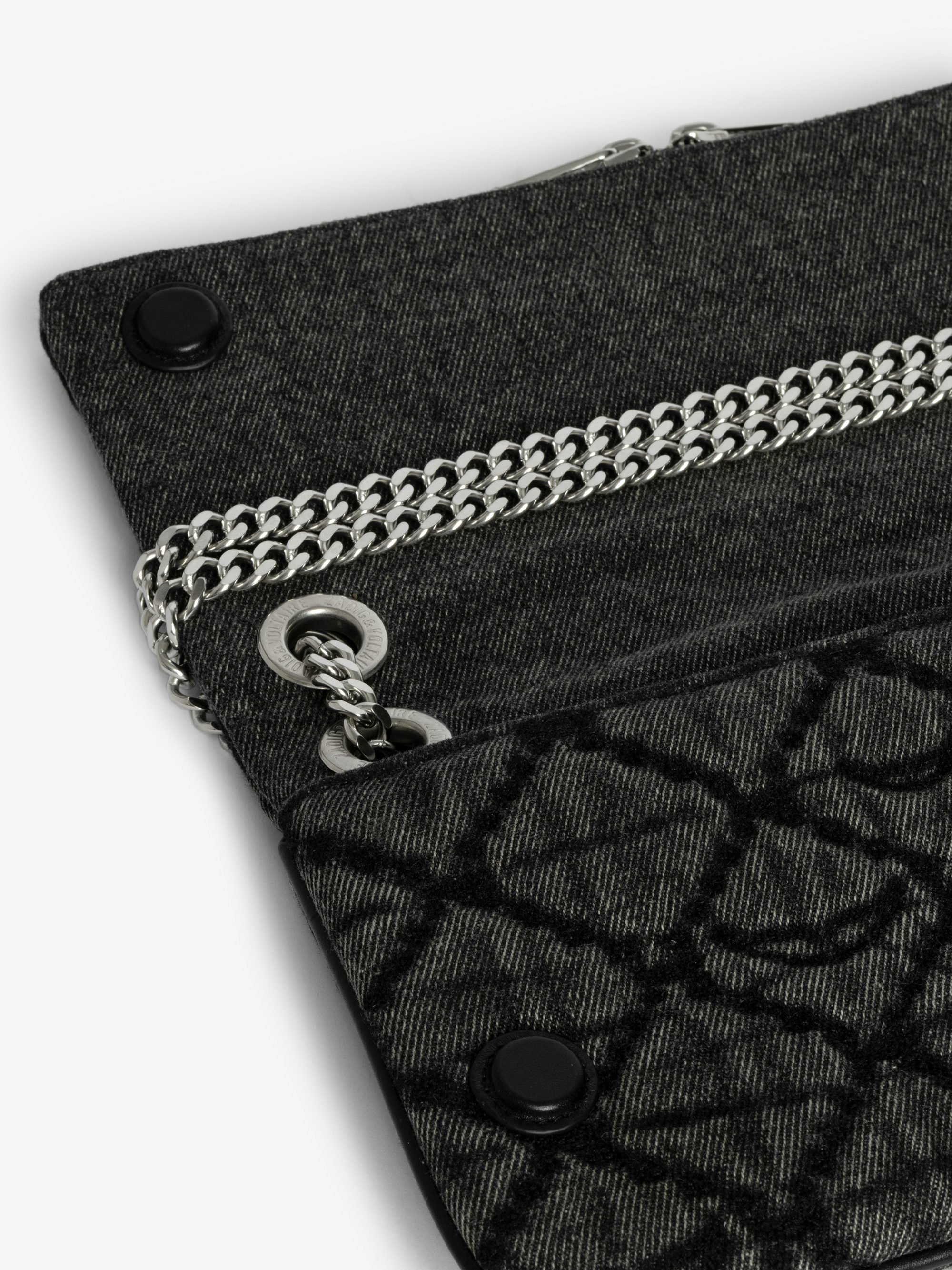 Rock II Monogram Clutch - Clutch in denim with sliding metal chain and signature wings.